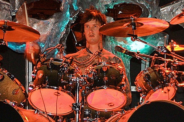 The Rev Drummer Perfoming Live On A Stage Playing Drums