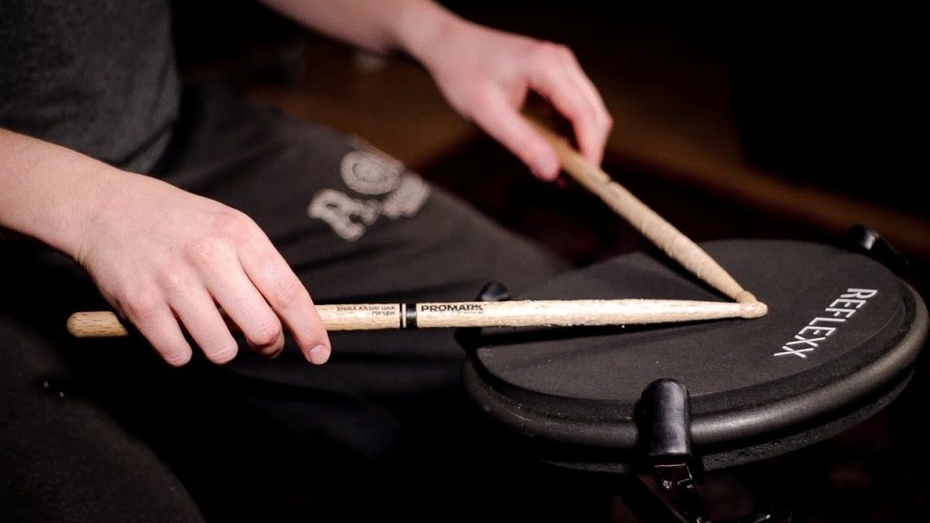 drum practice pad hands on drums