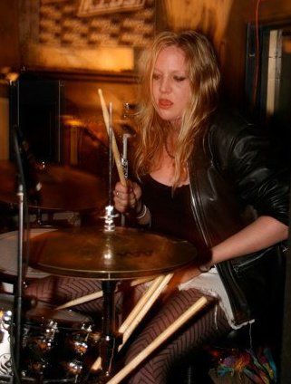 Gemma Clarke Is Playing Drums Passionately