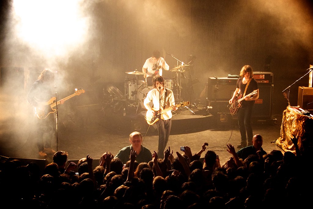 Matt Helders (Behind) Performs With Arctic Monkeys